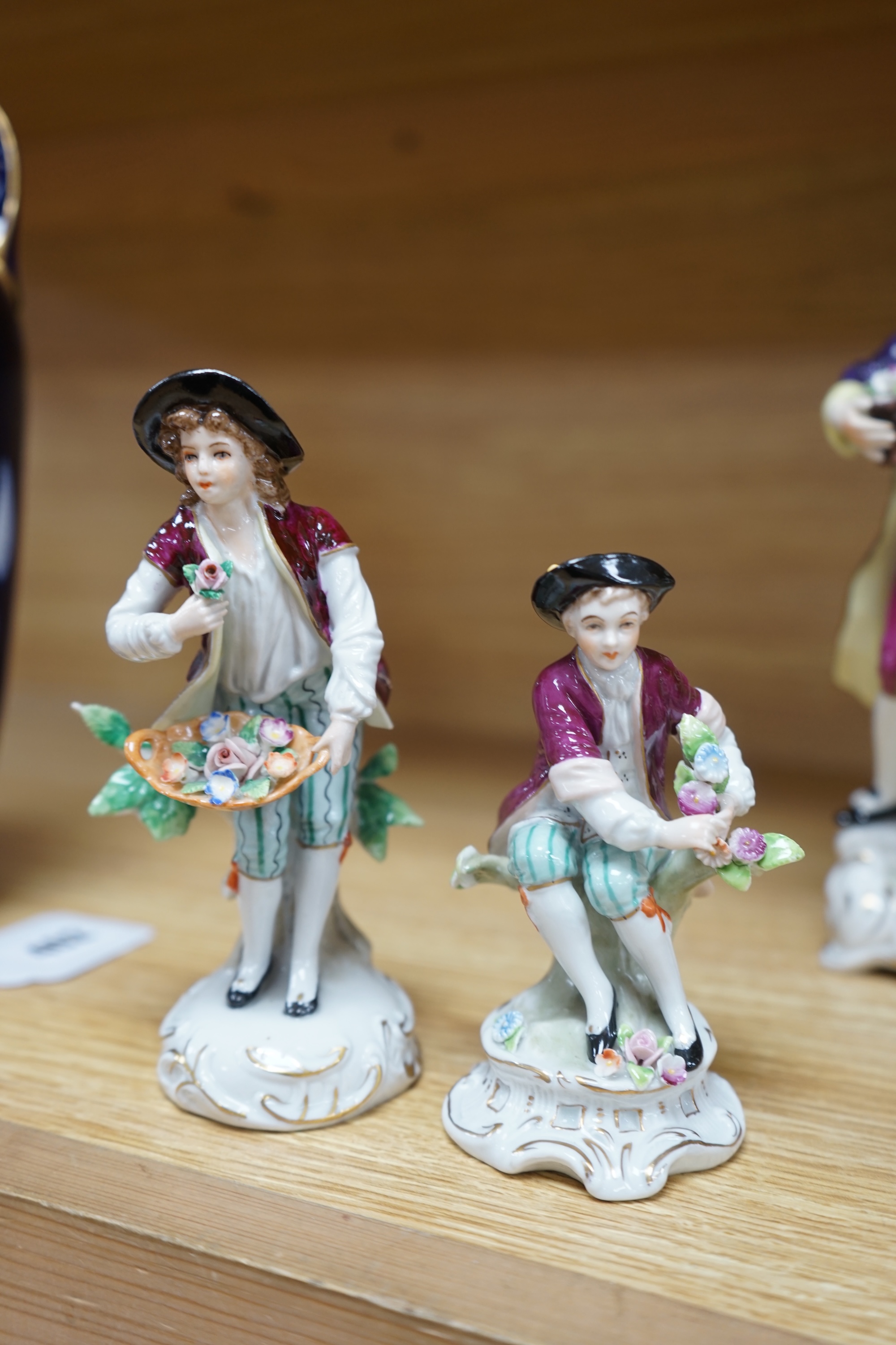 Five Continental figurines, three with Sitzendorf marks and two with crowned ‘K’s, tallest 22cm. Condition - good.